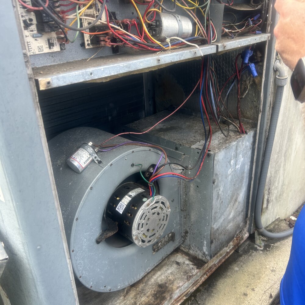Inside the old system — corroded blower and aged wiring
